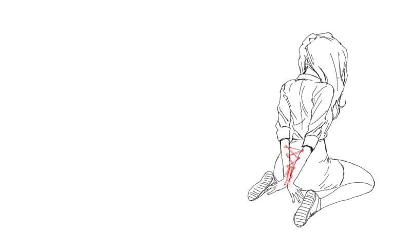 A woman on her knees, her arms stitched together behind her back